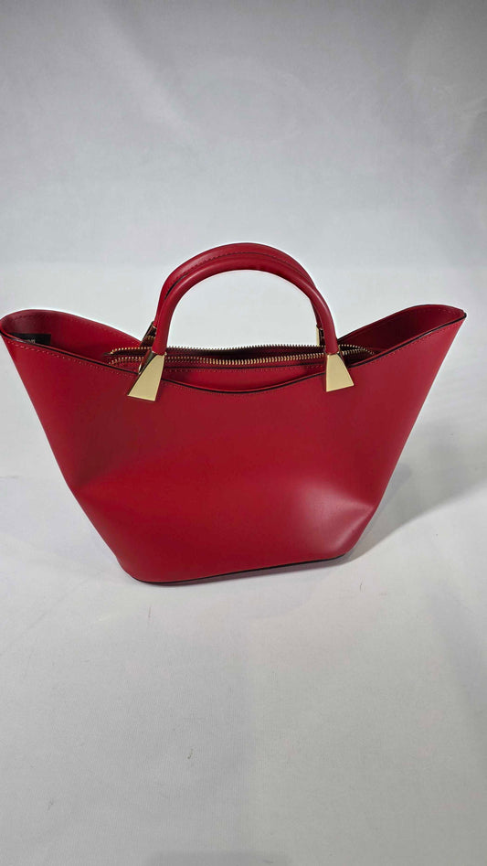 Red handbag with gold accents on a white background